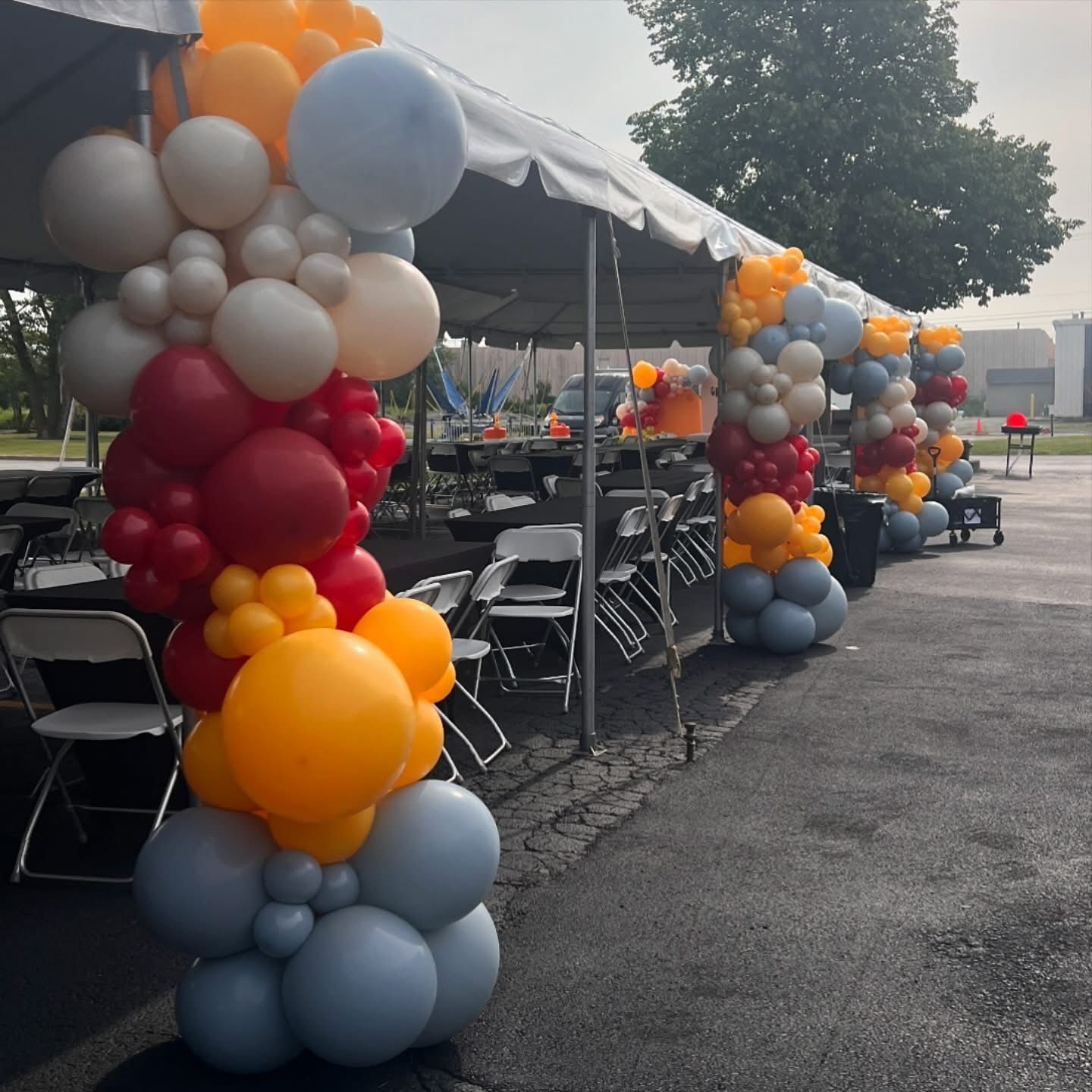 Balloon Garland on Tent Poles for a Client appreciation event 