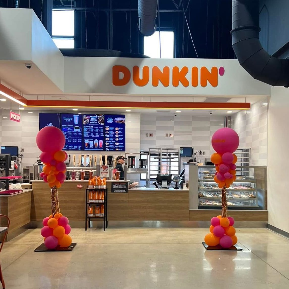 Simple Party Columns featuring Dunkin Donuts brand colors to help ensure customers see their new location 