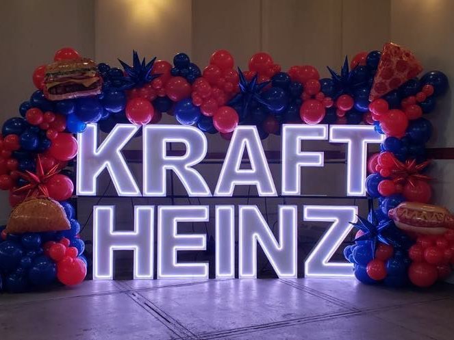 Kraft Heinz LED marquee display with a custom balloon garland, creating a striking corporate event decoration perfect for brand activations, promotions, and photo opportunities.