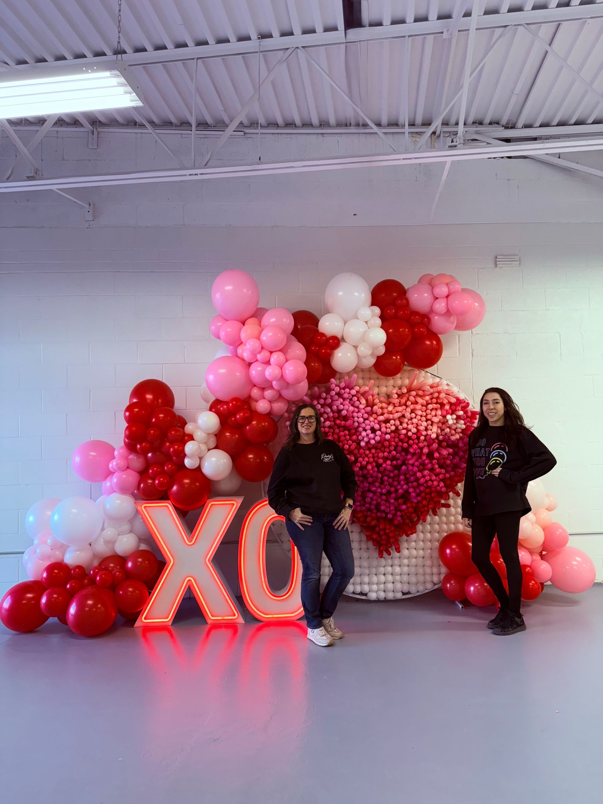 Outdoor Decor for UE event featuring our LED Marquees and Outdoor Deluxe Balloon Garland 