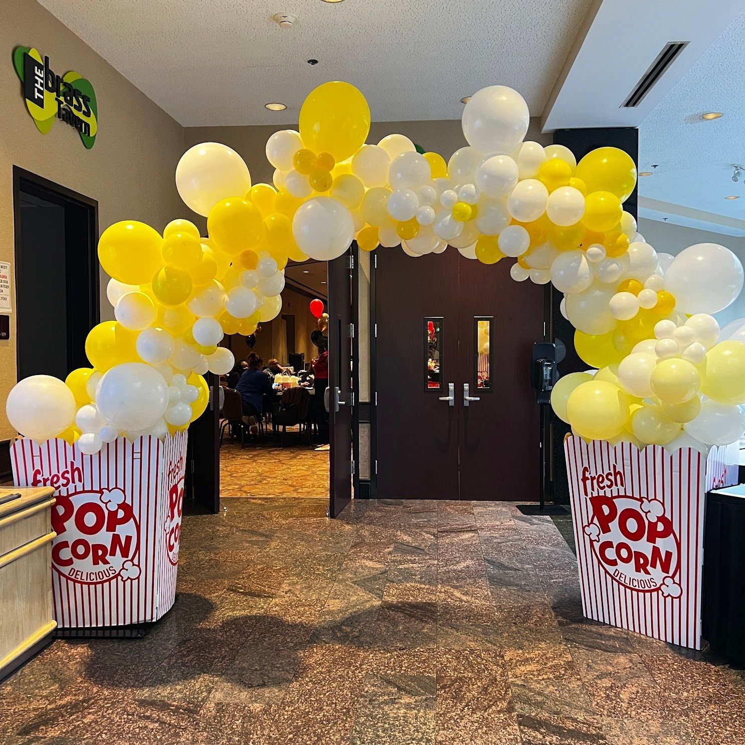 themed popcorn arch for an annual meeting 