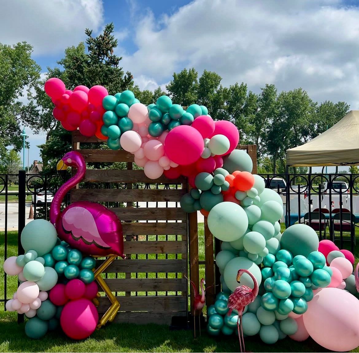Laua themed balloon backdrop for a senior home's family day