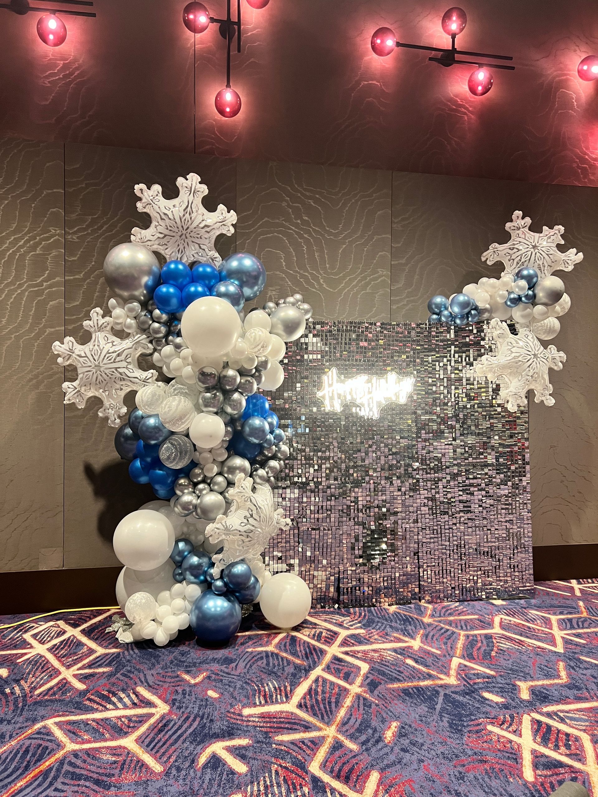Crook Industries Employee Appreciate event for the holidays with grand, lux, chrome, balloon arch welcoming party goers. 