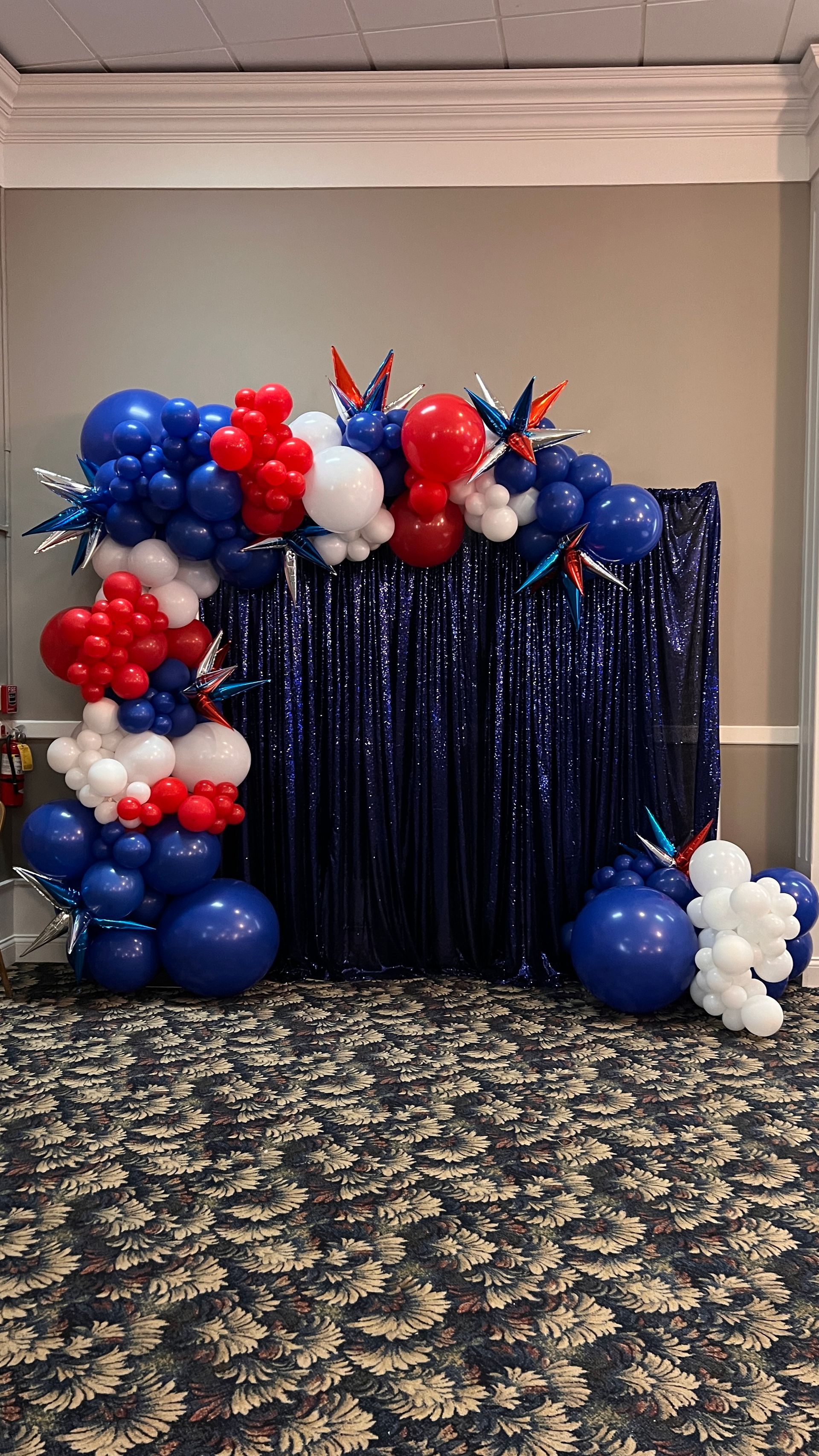 Patriotic Backdro with grand balloon garland for employee appreciation event in July 