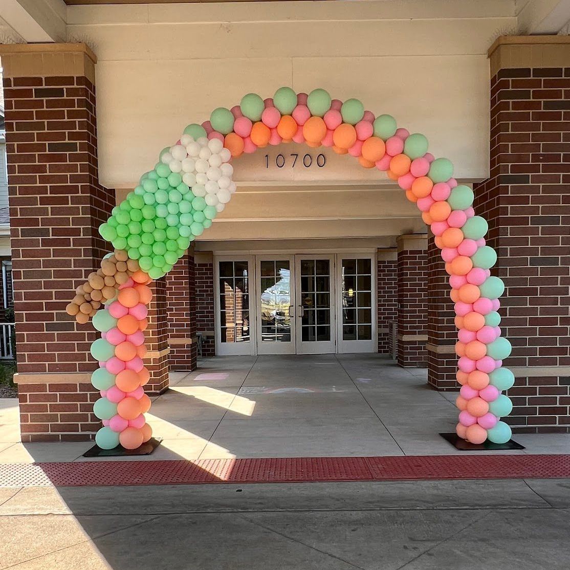 popsicle classic balloon arch and columns for a senior living home's marketing event 