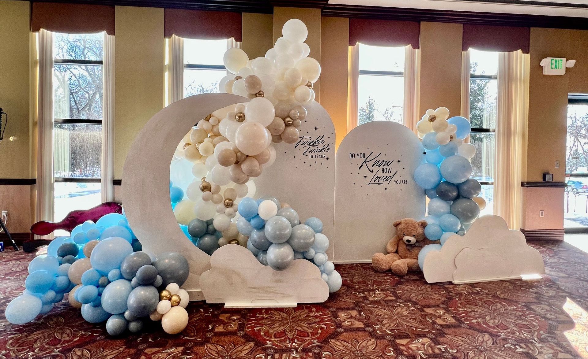Teddy bear-themed baby shower decor in blues and neutral colors with a 'Twinkle Twinkle Little Star' theme at the Center for Visual and Performing Arts in Munster, Indiana.