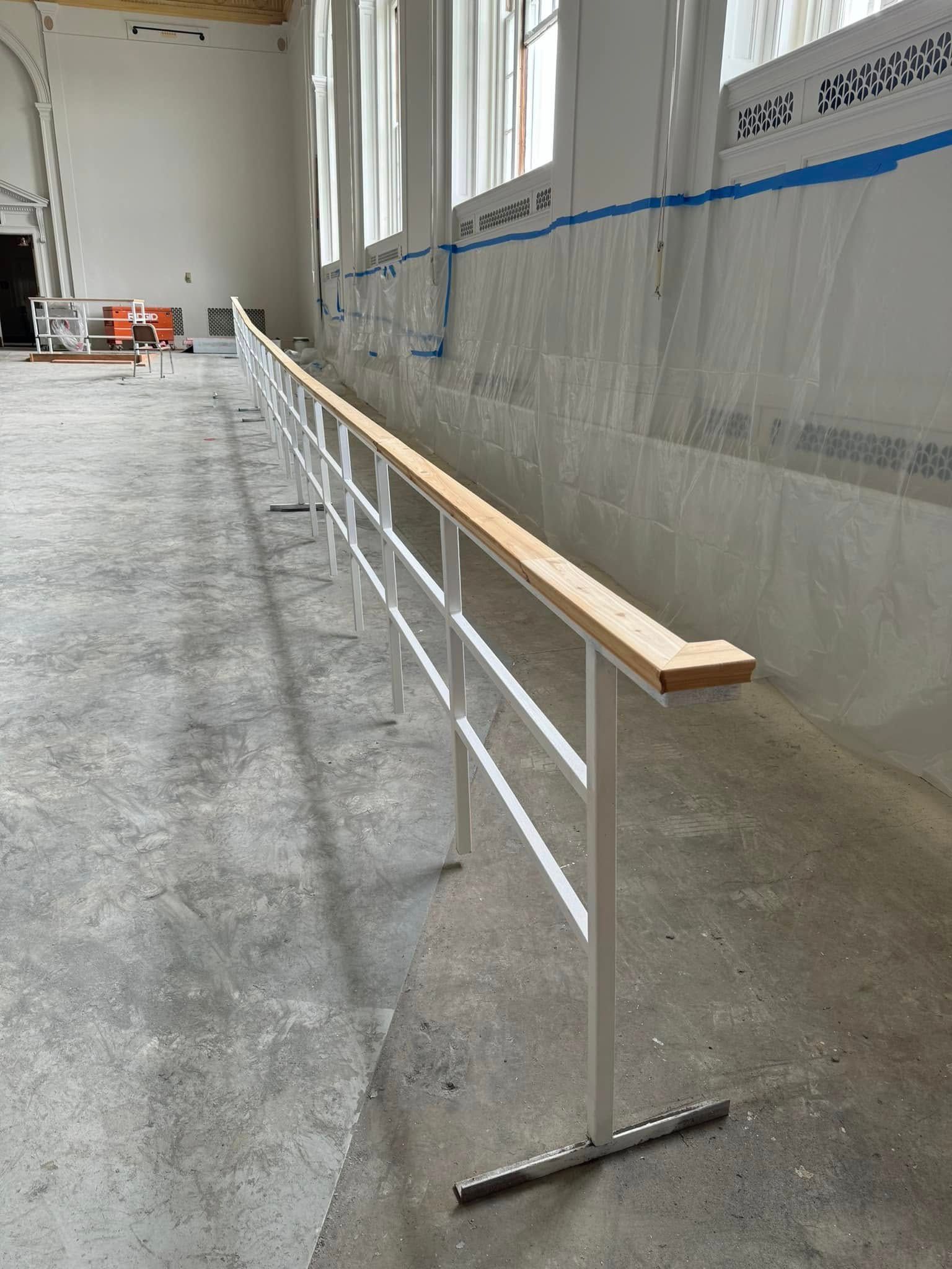 A wooden fence with a gate attached to it.