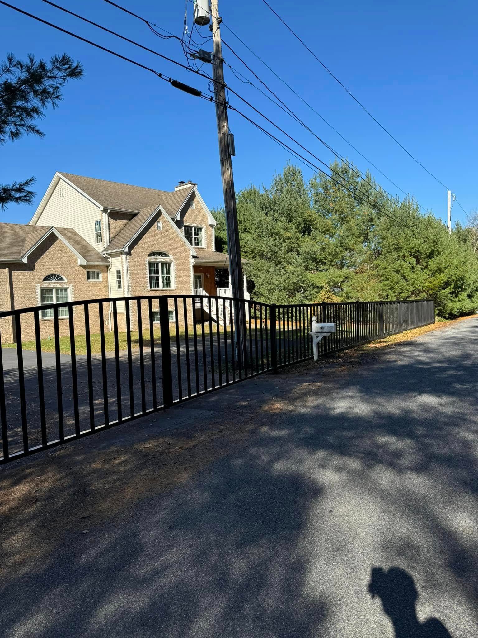 A wooden fence is sitting in the middle of a grassy field.