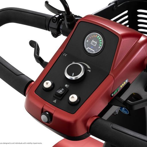 A close up of a red scooter with a black dashboard