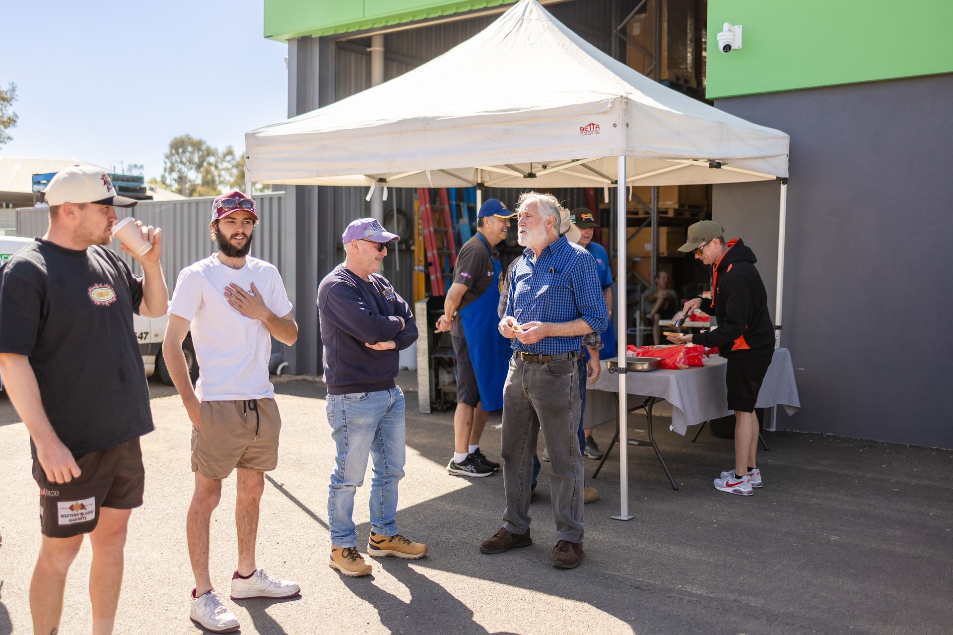 A group of people standing out the front of building Medley Refrigeration and Air Conditioning