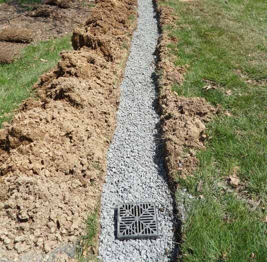 A Drainage System is Being Installed in a Yard