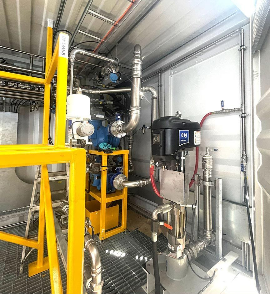 A Room with A Lot of Pipes and A Yellow Railing — Wades Distributors In Mackay, QLD