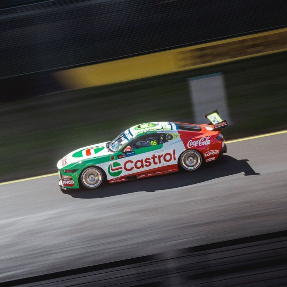 A Castrol Race Car Is Driving Down a Track — Wades Distributors In Mt Isa, QLD