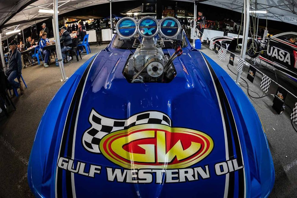 A Blue Gulf Western Oil Race Car Is Parked in A Garage — Wades Distributors In Darwin, NT