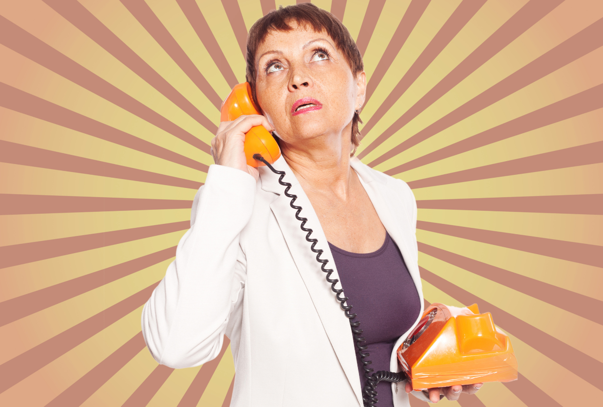 Woman holding an orange phone handset and looking up against a sunburst background