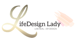 LifeDesign Lady logo with gold and black text, stylized flourishes, and the tagline “A Life By Design.”