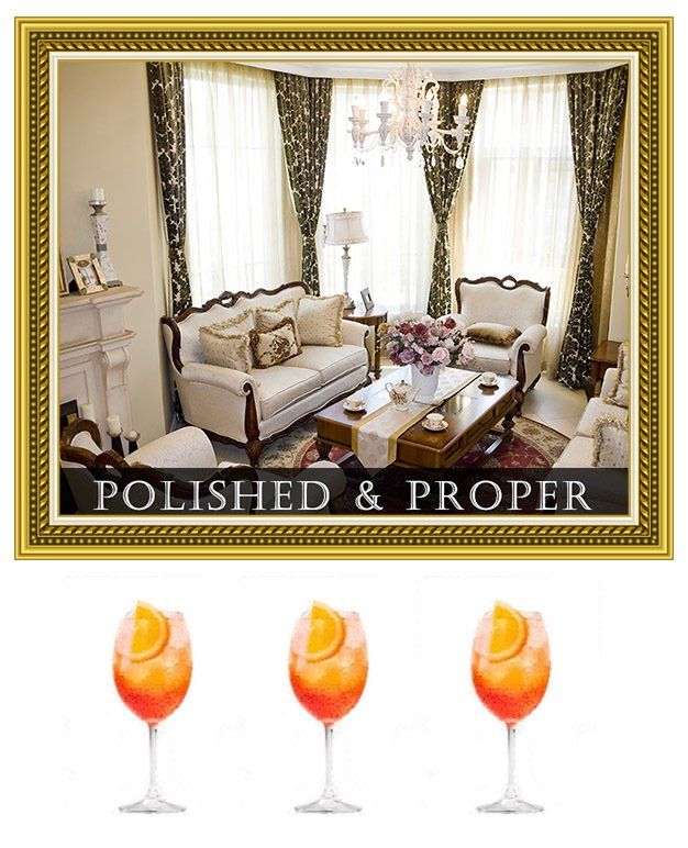 Elegant living room with gold frame and “POLISHED & PROPER” text above three orange cocktails