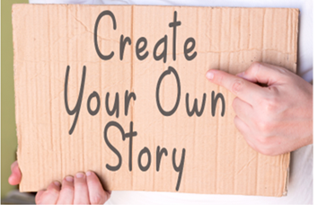 Hands holding a cardboard sign reading “Create Your Own Story”