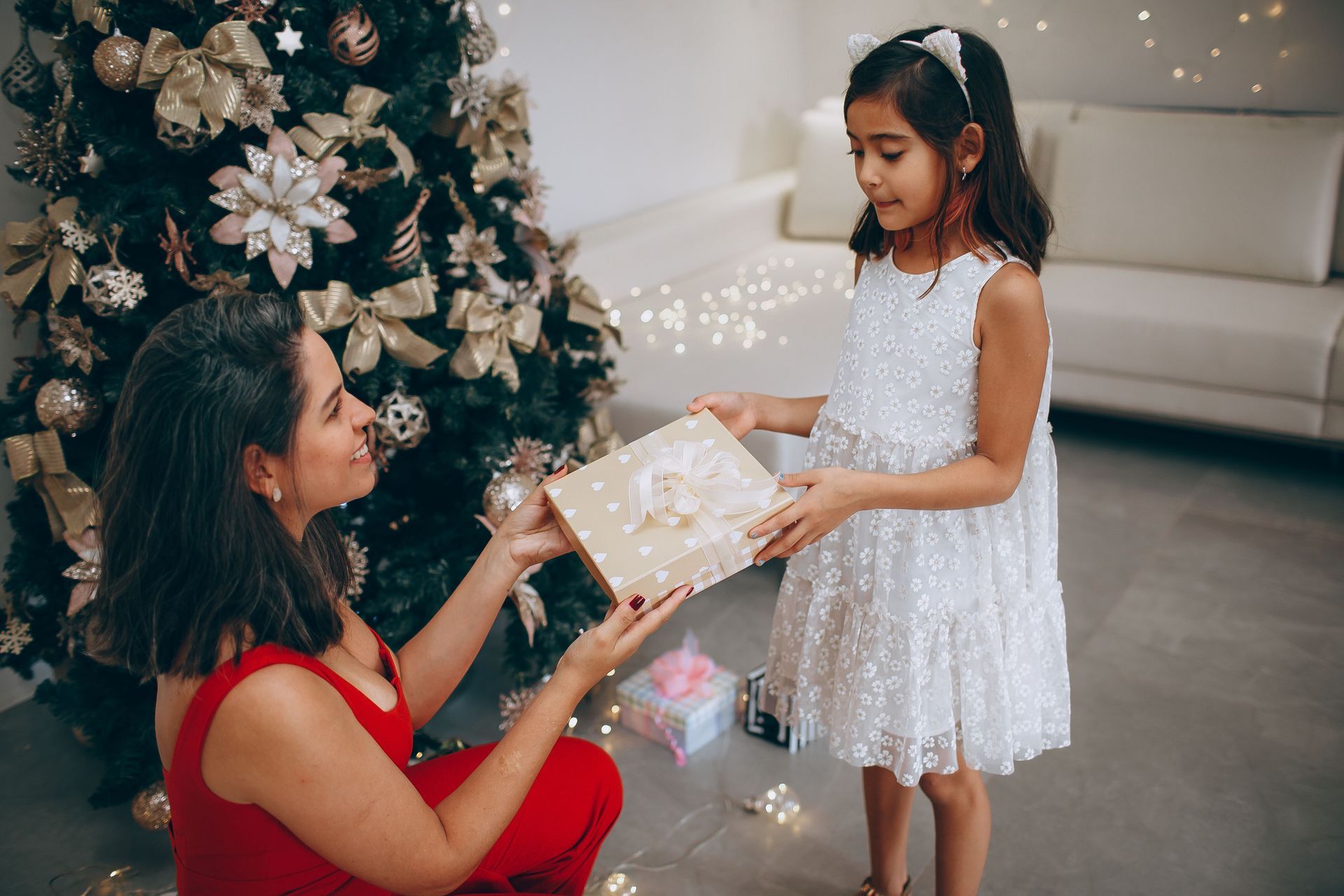 Mother and adult daughter exchanging a meaningful crystal gift
