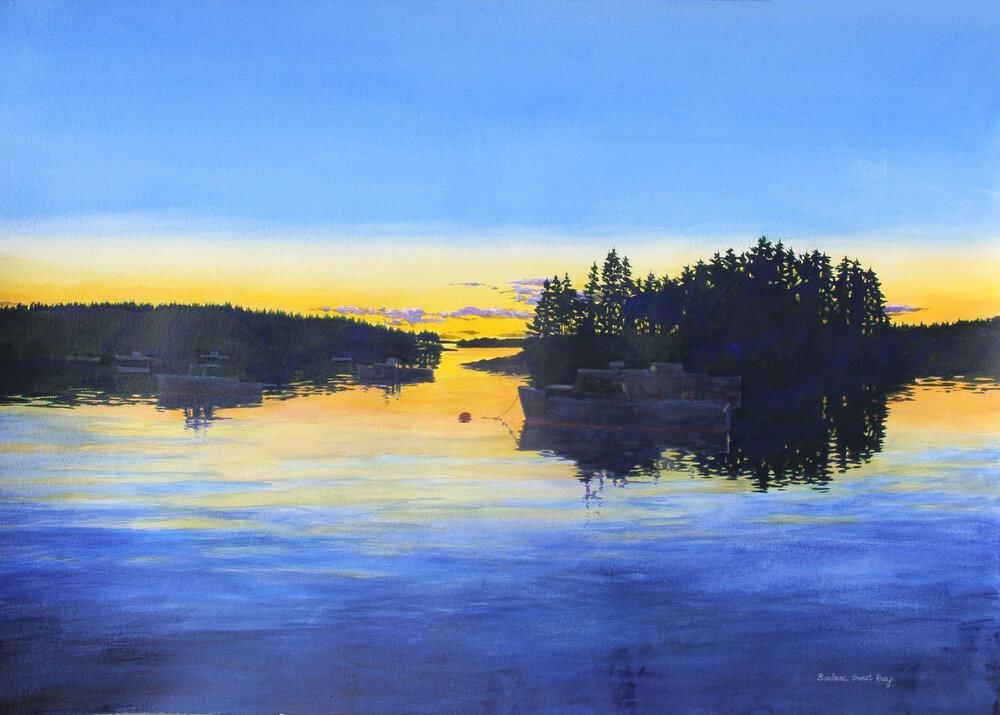 Sunset over a calm lake with silhouetted islands, reflecting blue and gold sky.