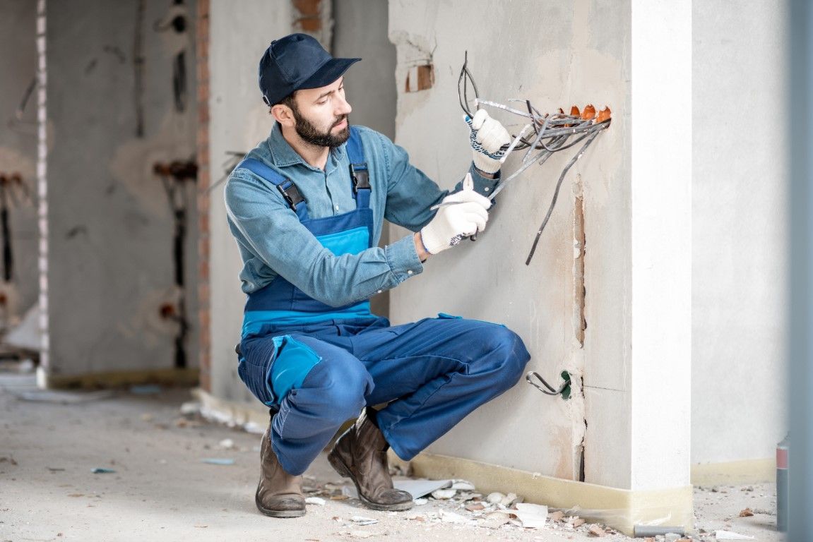 Working electrician providing service.
