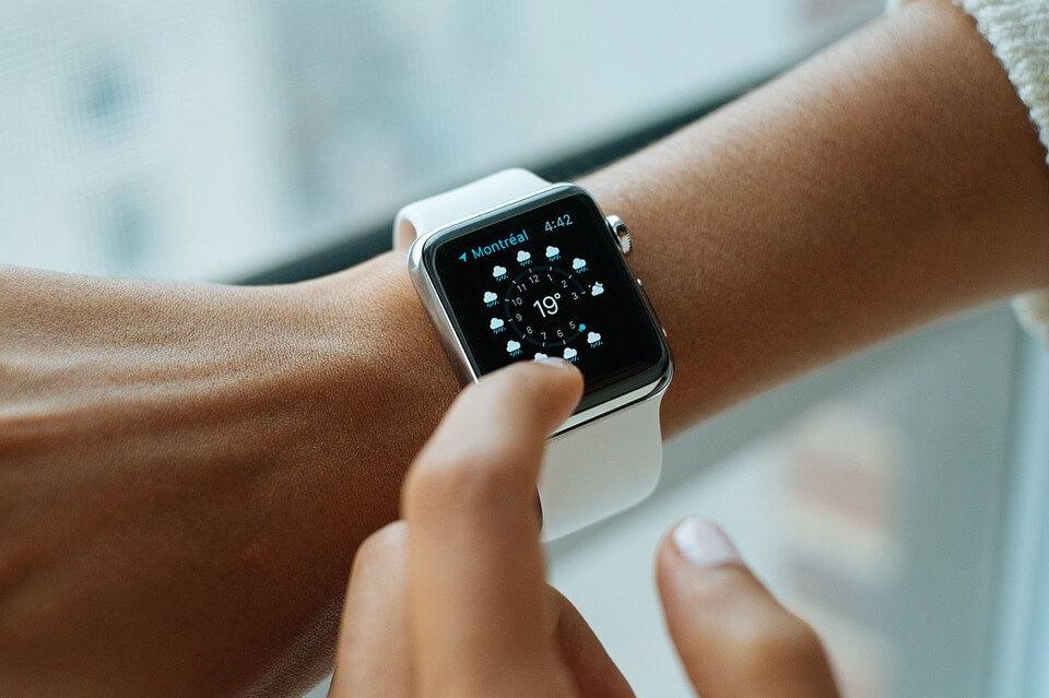 A person is wearing an apple watch on their wrist.