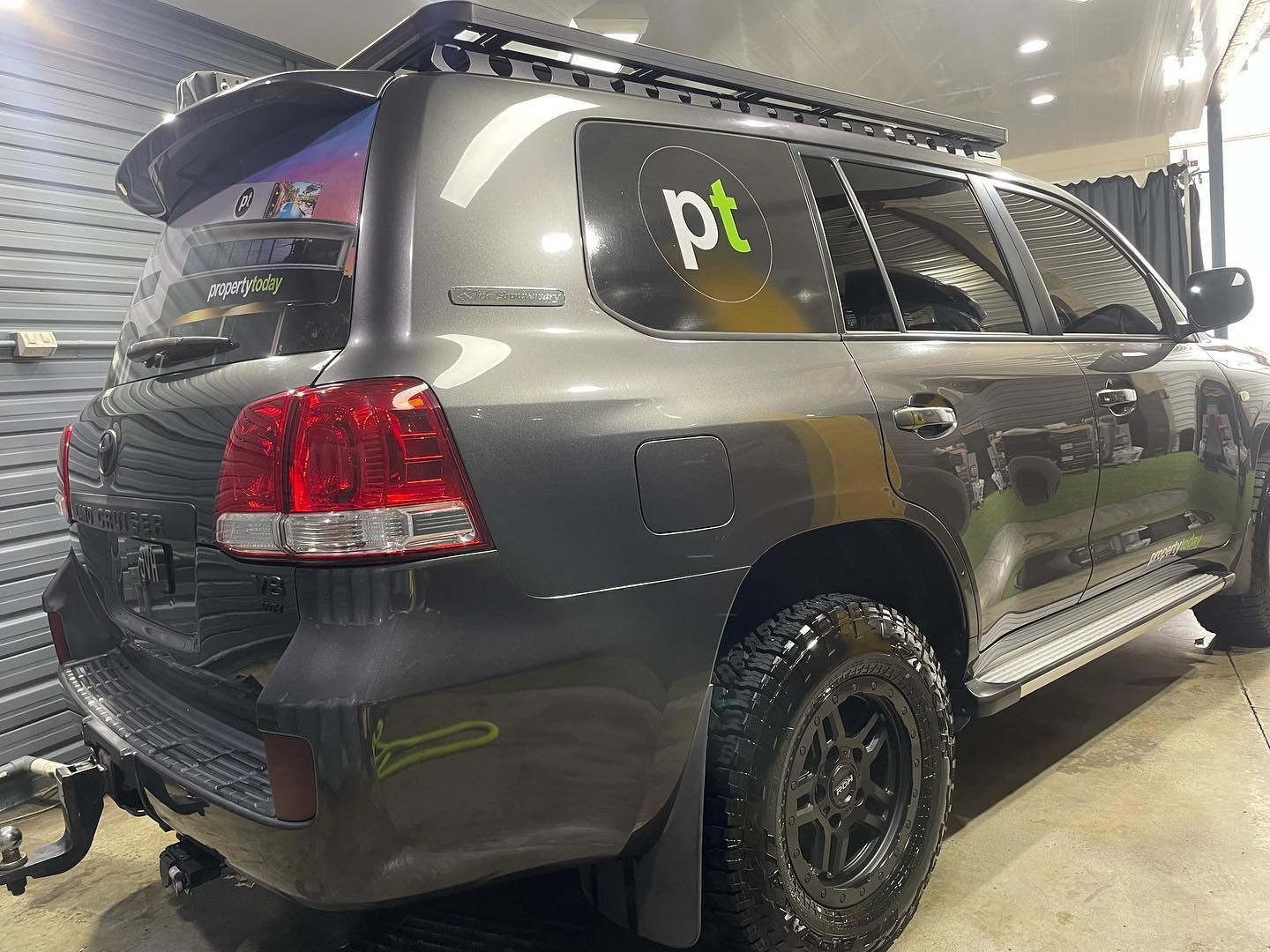 A toyota land cruiser is parked in a garage.