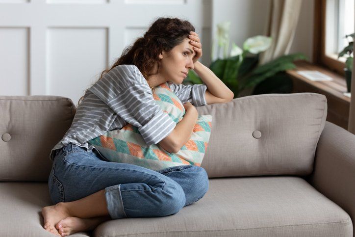 Lost in thoughts unhappy stressed woman