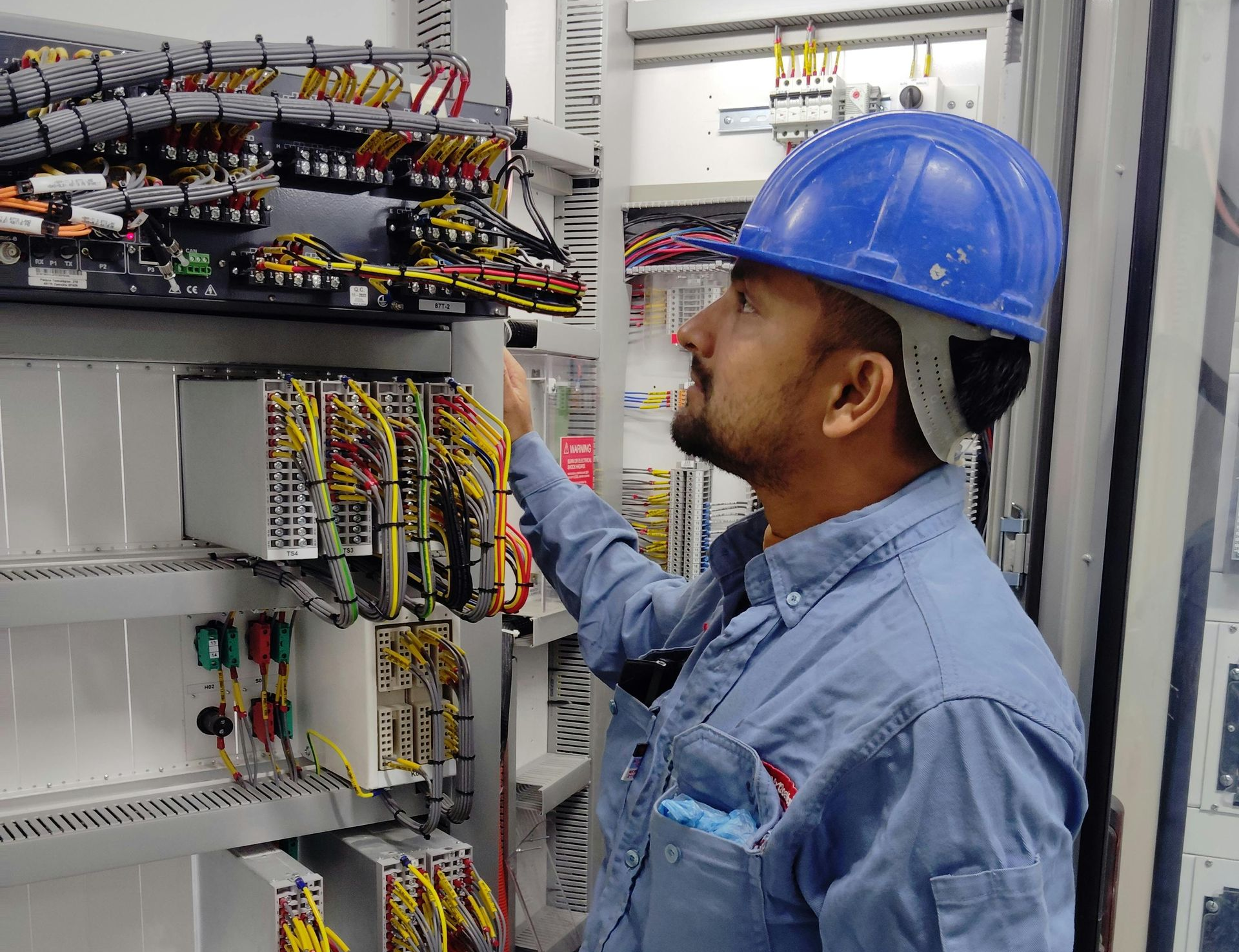an electrician inspecting some wires