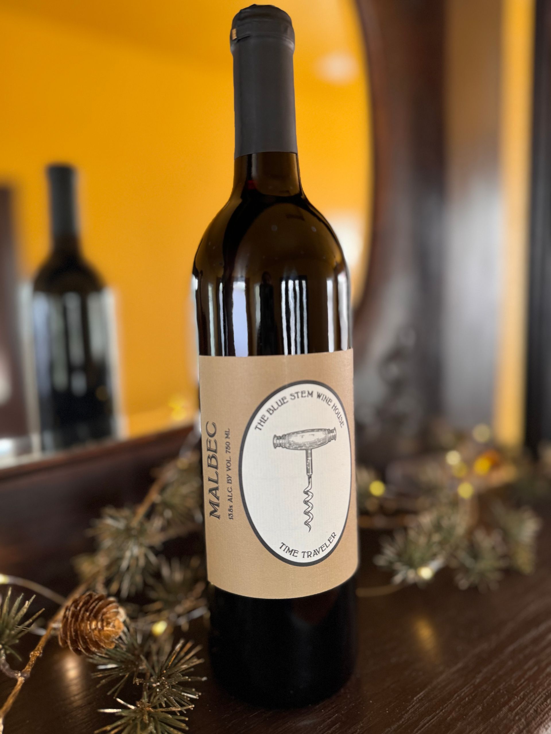 A bottle of malbec wine with a corkscrew on the label