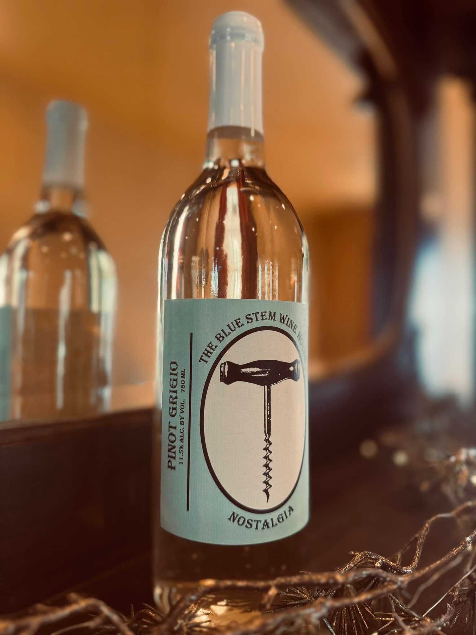 A bottle of pinot grigio wine with a corkscrew on the label