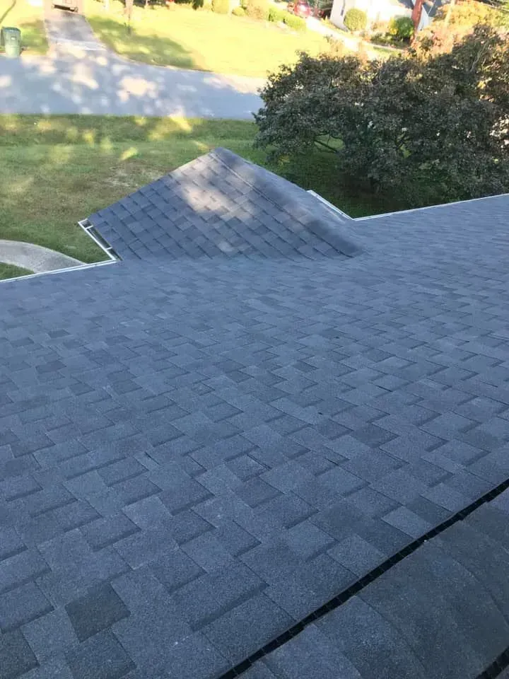 A close up of a roof with a lot of shingles on it.