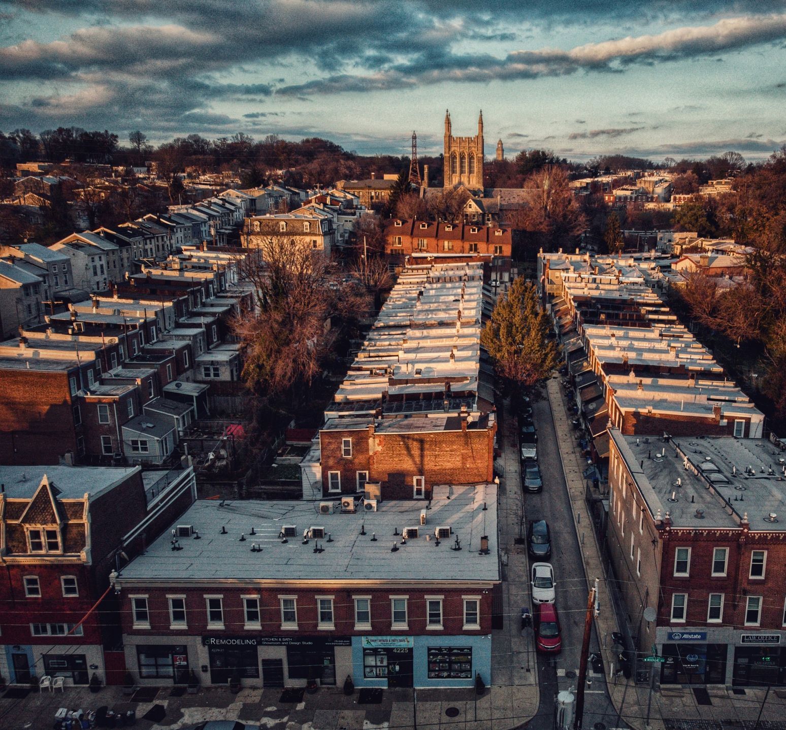 An aerial view of a city with a church in the background