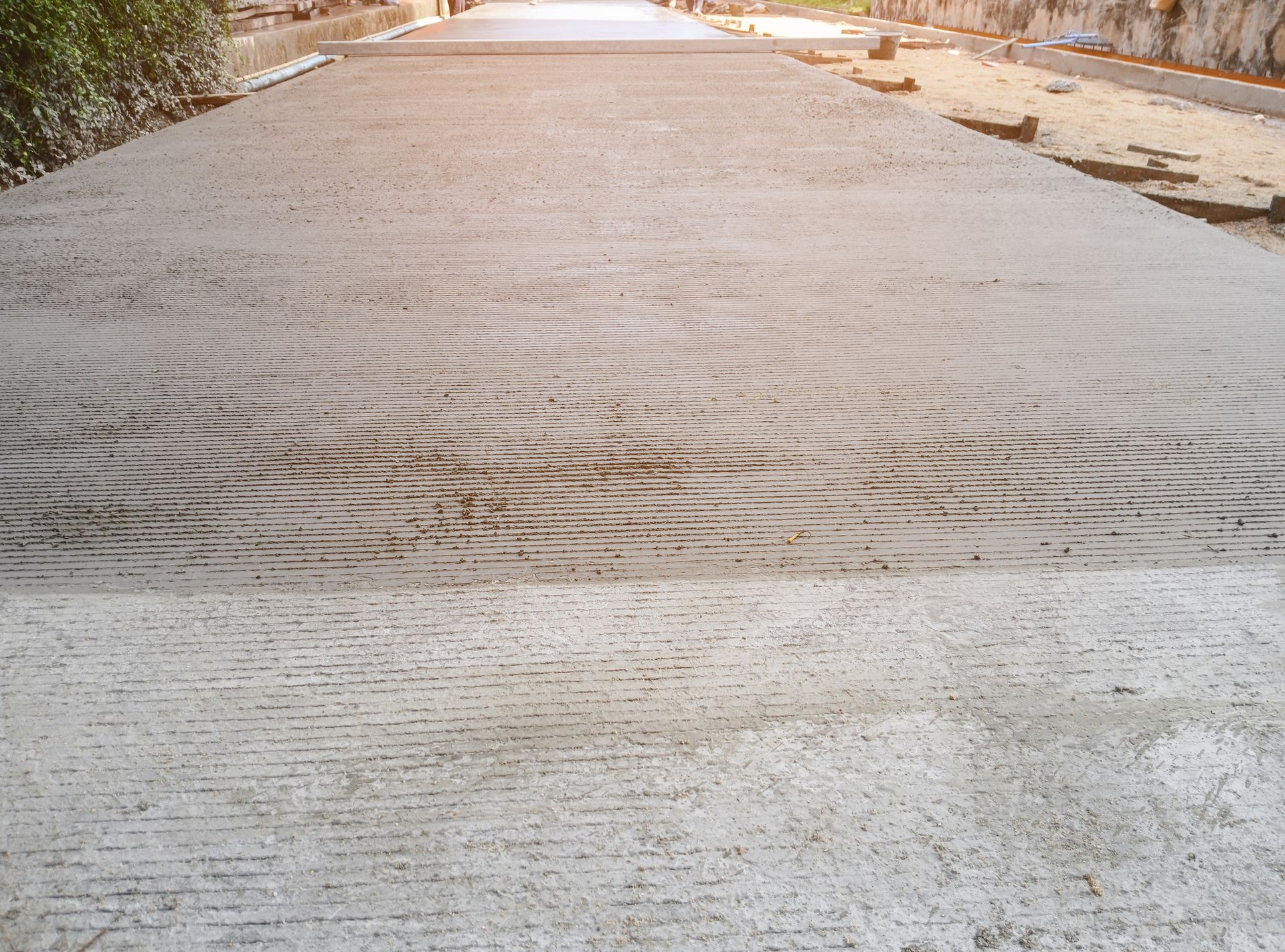 A close up of a concrete road with a pattern on it