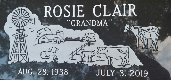 Gray memorial headstone for Rosie Clair with windmill, horse, house, tree, and dates Aug. 28, 1938 and July 3, 2019