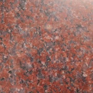 Close-up of red and black speckled granite surface