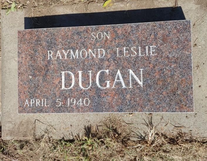 Granite memorial marker with engraved name Raymond Leslie Dugan and date April 5, 1940