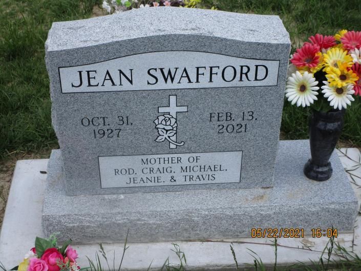 Jean Swafford gravestone with dates and flowers in a cemetery