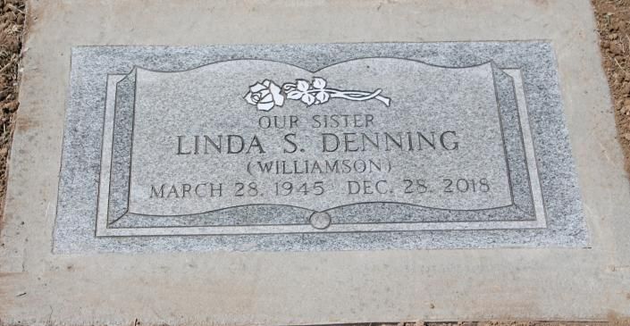 Gravestone plaque reading “Our sister Linda S. Denning Williamson,” with birth and death dates.