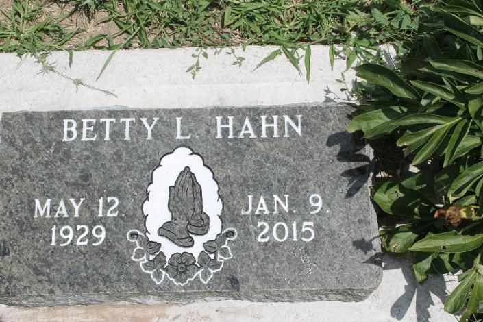Betty L. Hahn gravestone with dates May 12, 1929 and Jan. 9, 2015, beside greenery