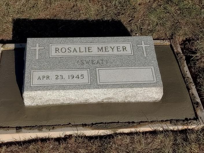 Gravestone for Rosalie Meyer with cross, dated Apr. 23, 1945.