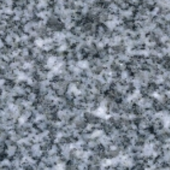 Gray speckled granite or stone surface with black and white flecks