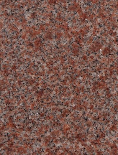 Close-up of a speckled red, gray, and black granite surface