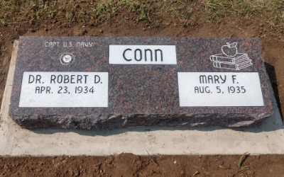 Gray memorial plaque for Conn with names Dr. Robert D. and Mary F. and their birth dates.