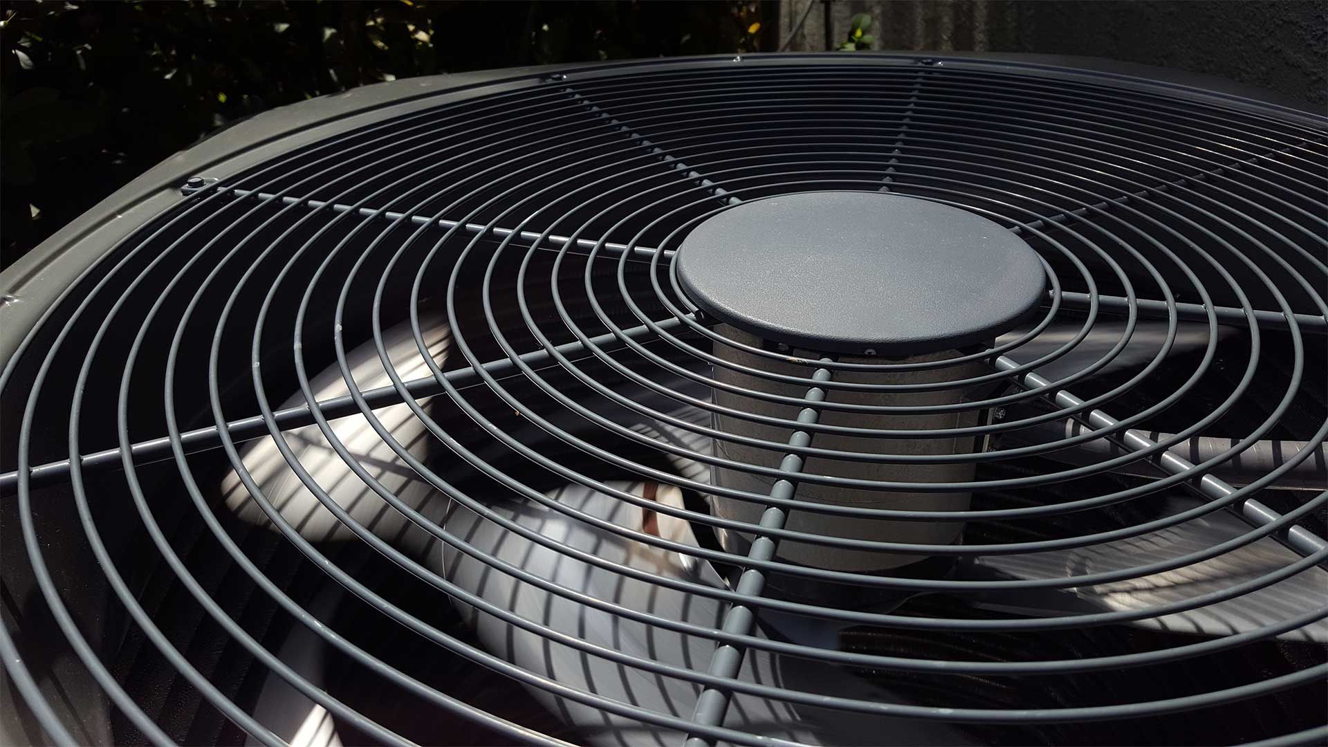 A close up of a fan with a circular design