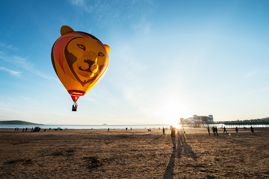 Visitors watching a hot air balloon on the beach in Weston-super-Mare.