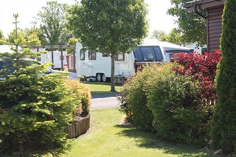 Caravan on a seasonal touring pitch in Somerset