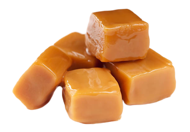 A pile of caramel cubes stacked on top of each other on a white background