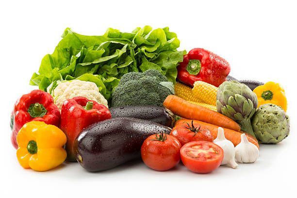 A variety of fresh vegetables on a white background