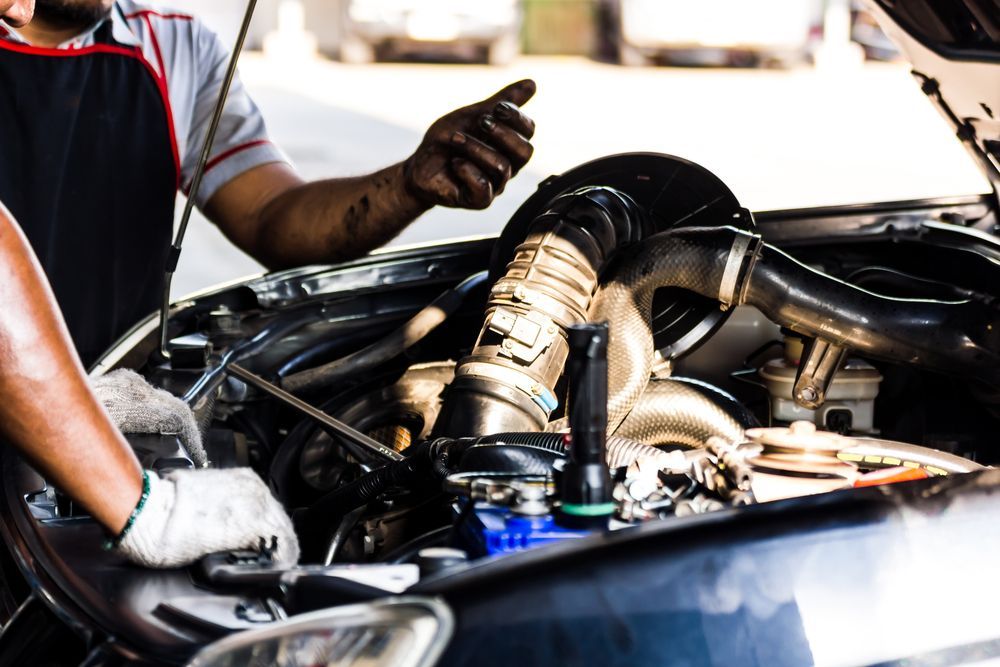 Mechanic Working on a Car Engine in an Open Garage — GZM 4x4 Performance In Ballina, NSW